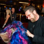 Stylists from Antonino Salon in Birmingham demonstrate innovative styling techniques on stage.