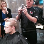 Randy Dingus Jr. demonstrates barbering techniques